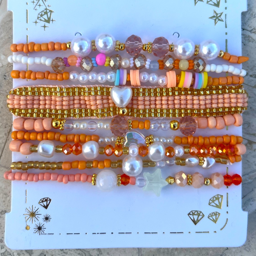 Handmade Colombian beaded peach theme bracelets.